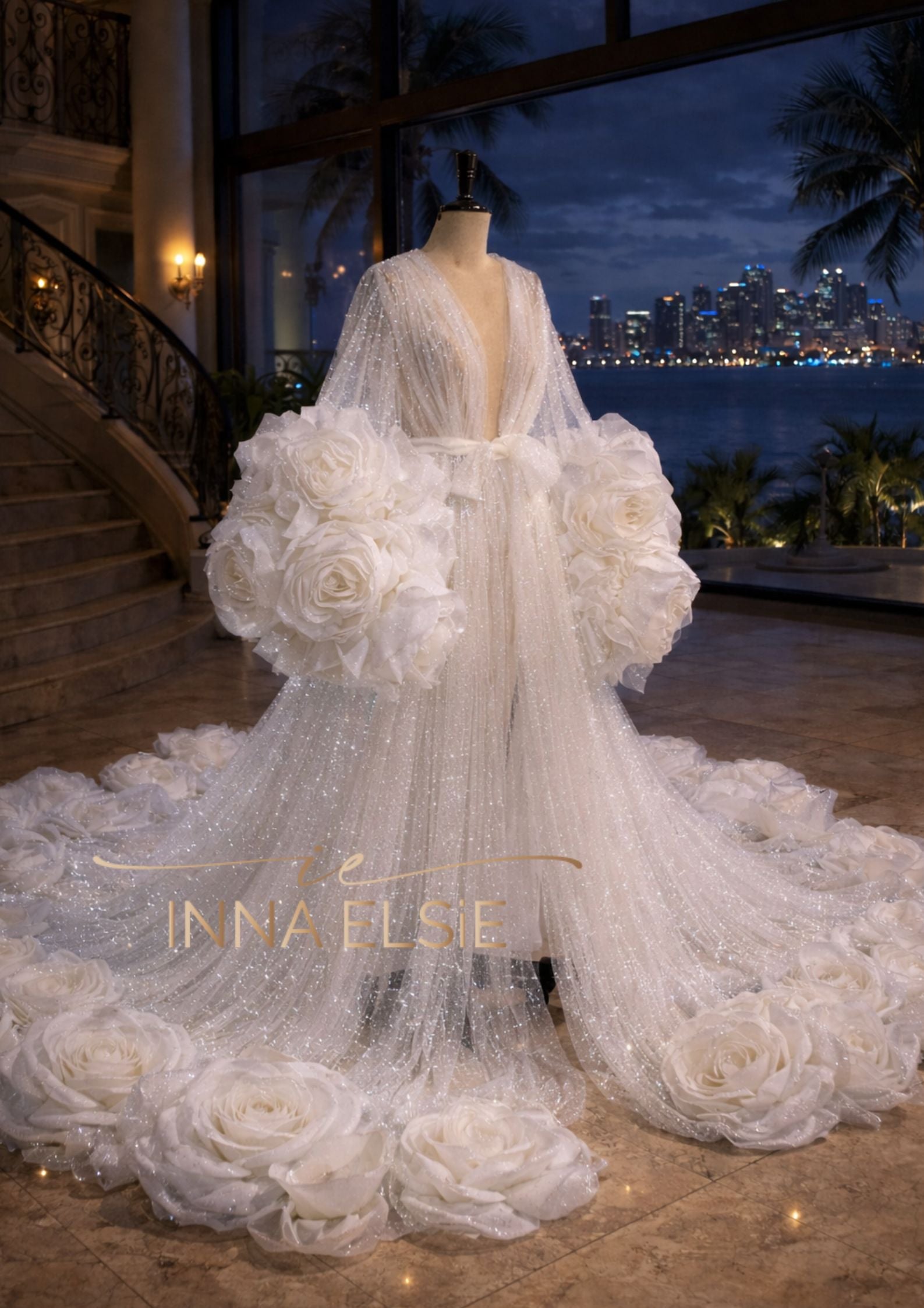 Elegant white wedding dress with floral details on a mannequin against a cityscape background.