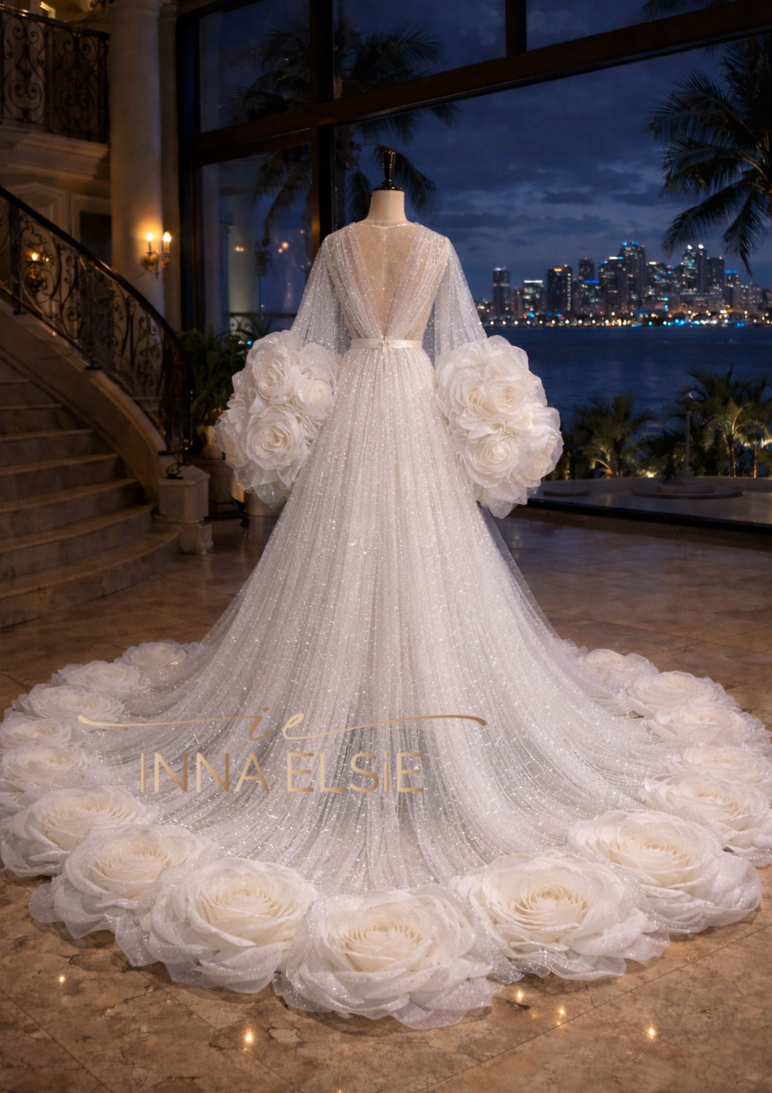 Elegant white wedding dress with floral details on a mannequin in a luxurious setting.