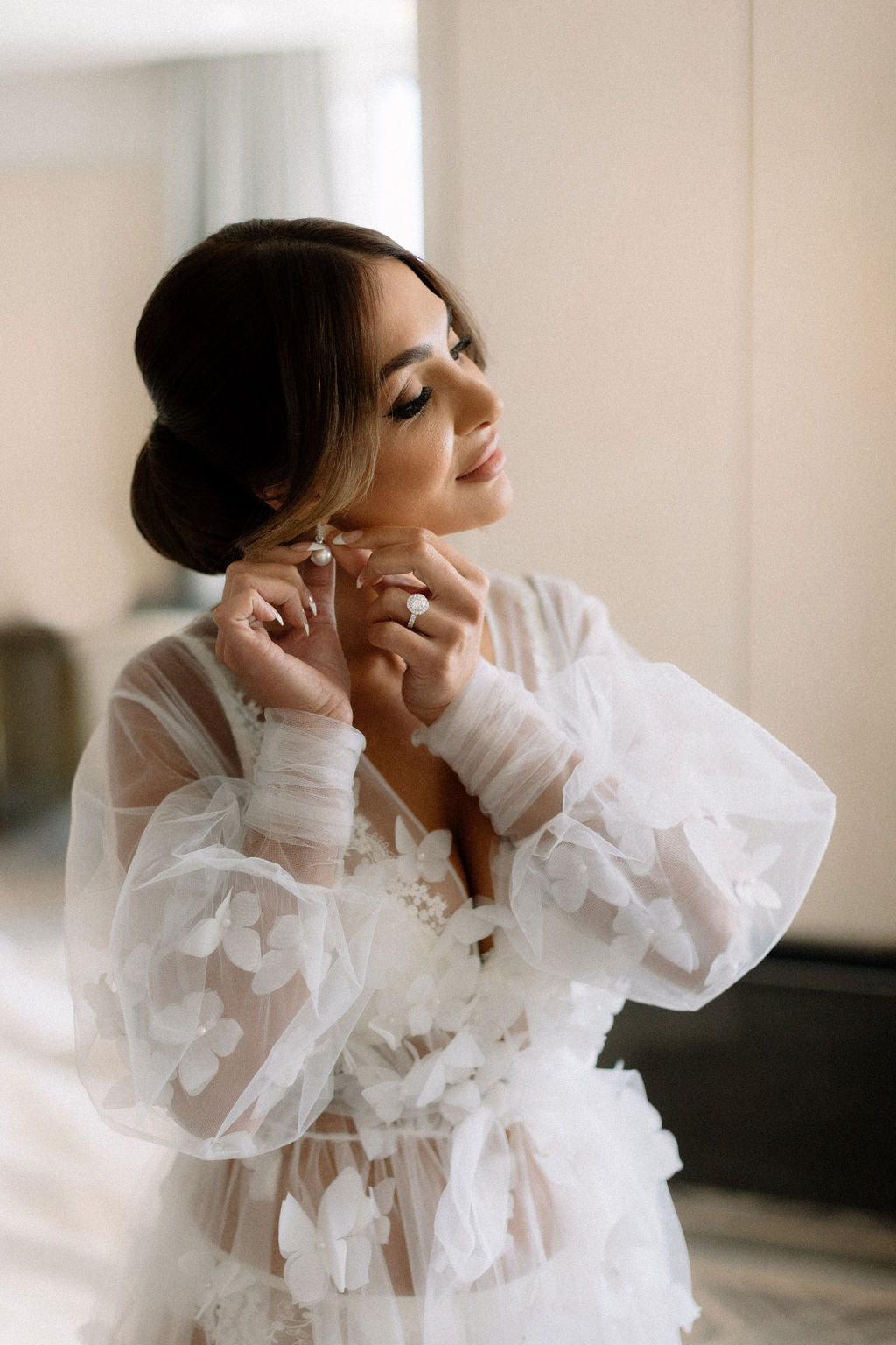 Luxurious white satin bridal robe with lace detailing for the bride